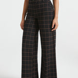 Front view of Black Brown Plaid wide-leg Dress Pant Yoga Pants showing the high-rise fit and flowing trouser legs