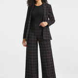 Woman wearing Black Brown Plaid wide-leg Dress Pant Yoga Pants with the matching plaid Classic Blazer