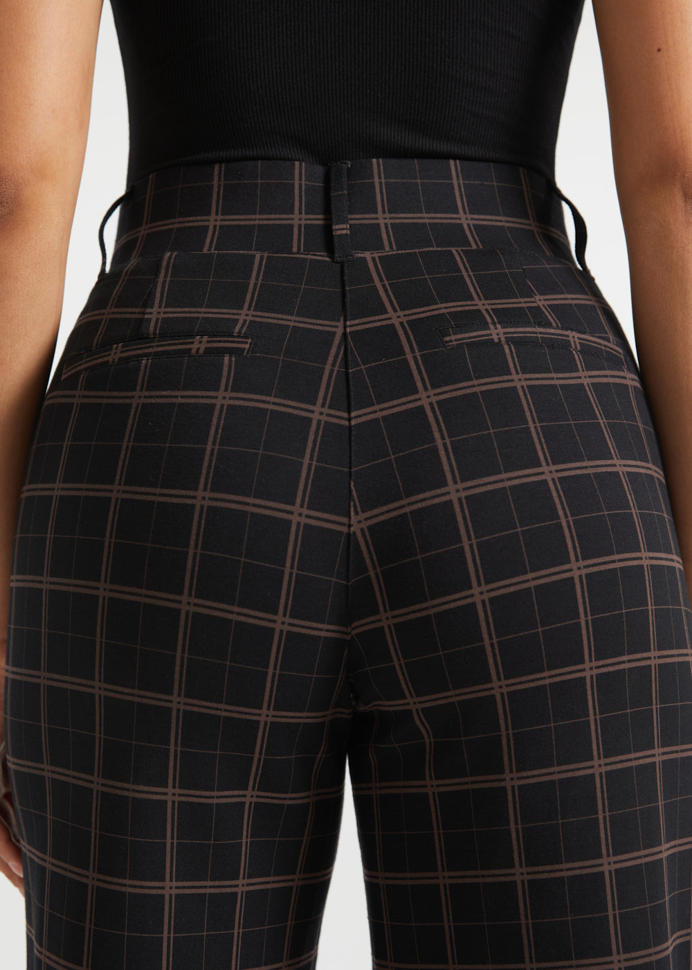 Close-up rear view of Black Brown Plaid high-waisted pants showing the tailored back seaming and faux welt pockets