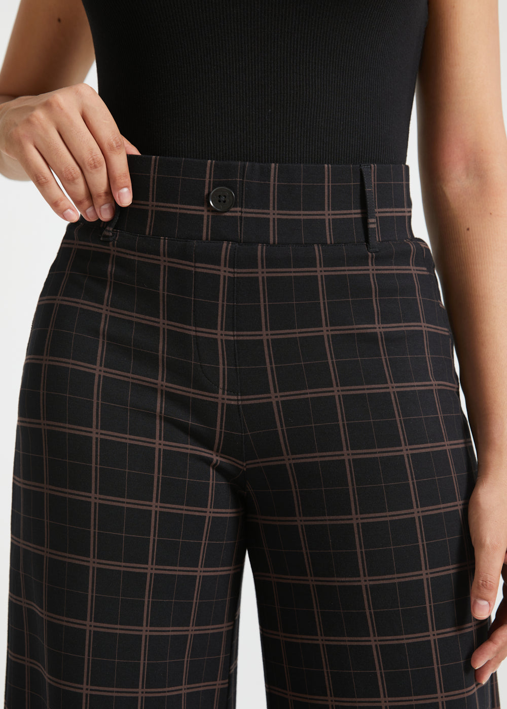 Close-up of Black Brown Plaid Dress Pant Yoga Pants showing the high waistband, belt loops, faux fly and decorative button