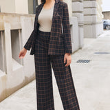Woman wearing matching Black Brown Plaid wide-leg Dress Pant Yoga Pants and Classic Blazer outdoors