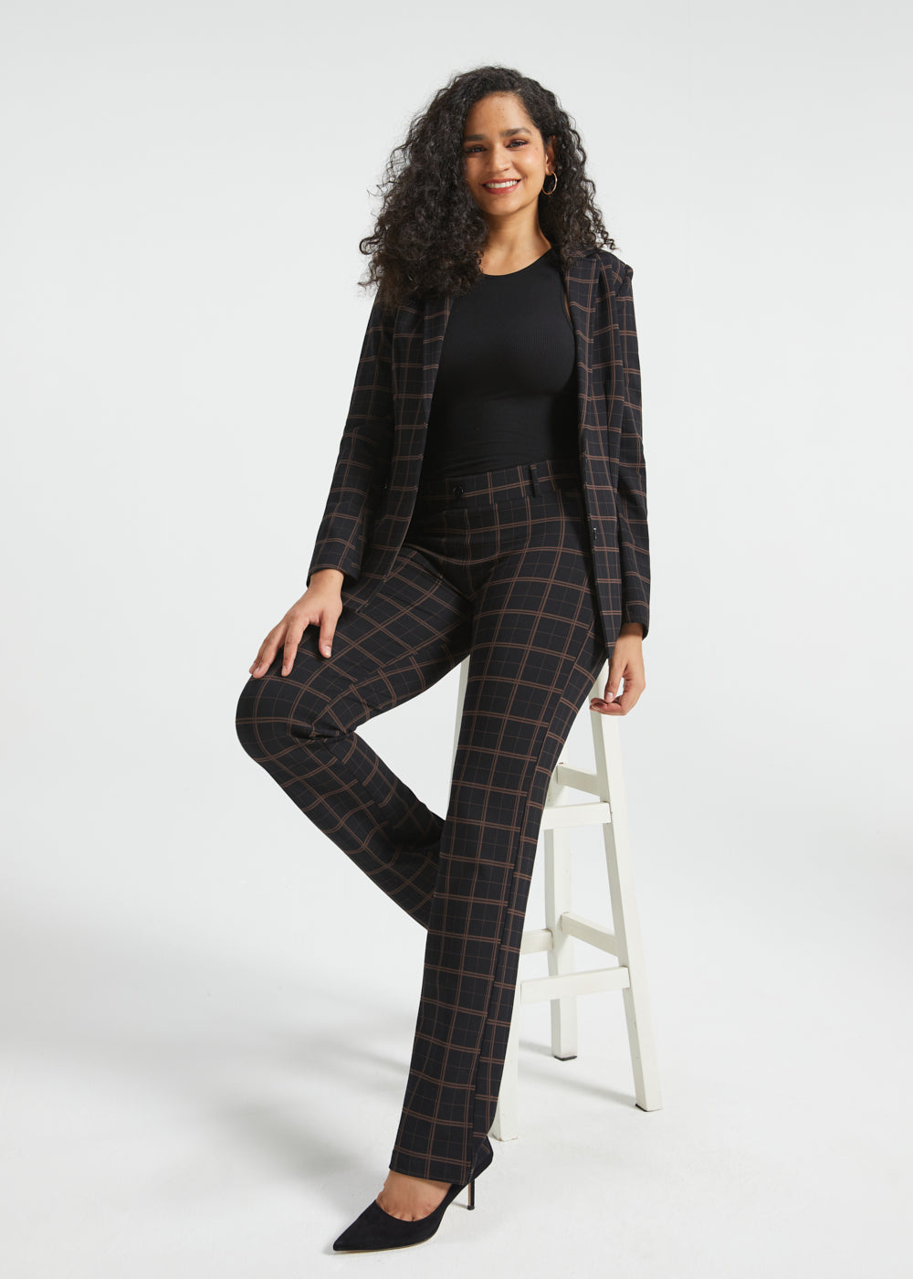 Woman wearing Black Brown Plaid straight-leg Dress Pant Yoga Pants with the matching Classic Blazer and black heels