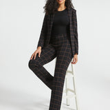 Woman wearing Black Brown Plaid straight-leg Dress Pant Yoga Pants with the matching Classic Blazer and black heels