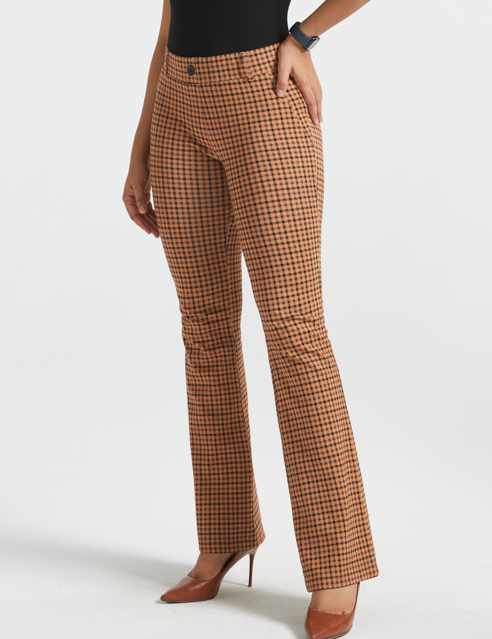 Woman wearing Camel Mini Houndstooth straight-leg Dress Pant Yoga Pants with a black sleeveless top and brown heels, front view