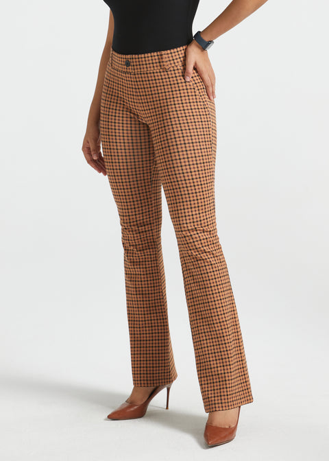 Woman wearing Camel Mini Houndstooth straight-leg Dress Pant Yoga Pants with a black sleeveless top and brown heels, front view