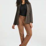 Woman wearing Camel Mini Houndstooth Dress Pant Yoga Pants styled with a dark brown blazer, black top and brown heels