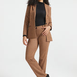 Woman wearing Camel Mini Houndstooth Classic Blazer with matching straight-leg pants, black turtleneck and black heels