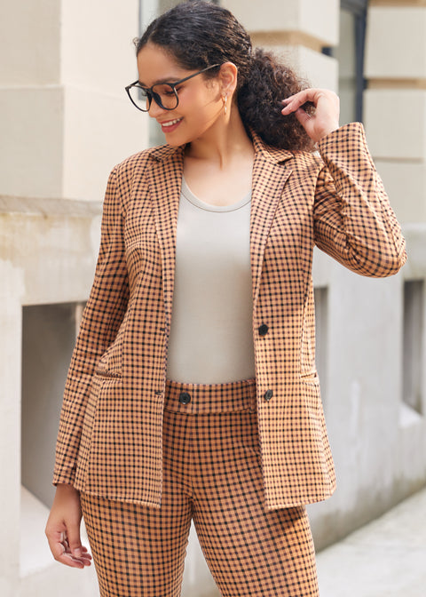 Close-up outdoor view of woman wearing Camel Mini Houndstooth Classic Blazer with matching pants and neutral top
