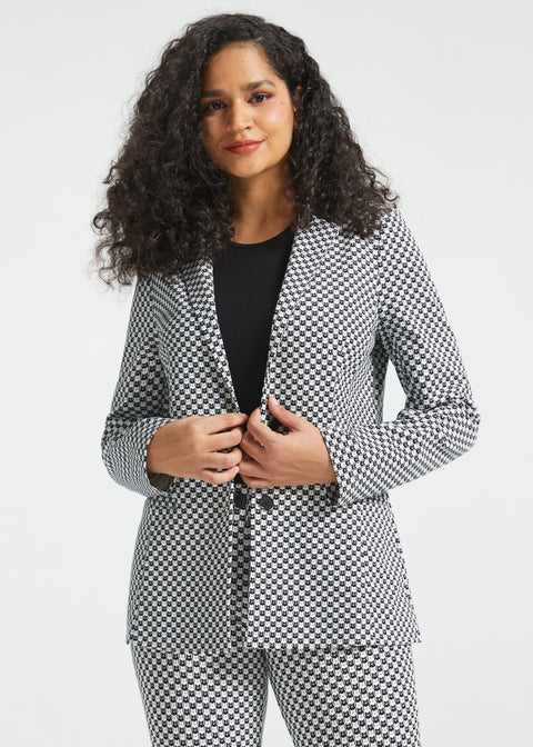 Woman wearing the Betabrand Black Ivory Catstooth Classic Blazer with matching cat print pants and a black top, front view