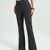 Dark gray flared dress pants worn by a woman on a white background