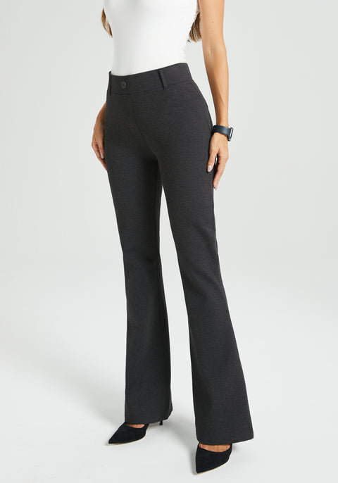 Dark gray flared dress pants worn by a woman on a white background