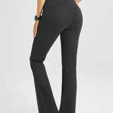 Charcoal gray bootcut flared pants worn by a woman on a white background